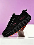 Black Mesh Running Sneakers with Chunky Orange-Studded Sole